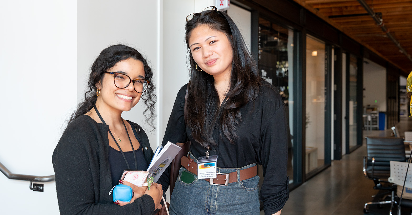 Two interns smile for the camera