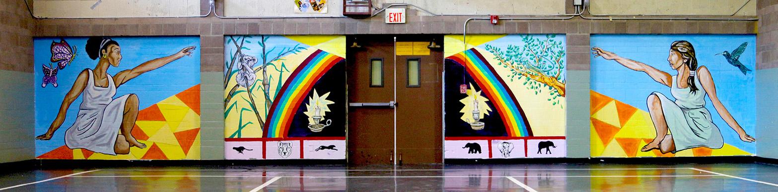 Image of two women on either side of a rainbow